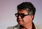Oscar-nominated director Jafar Panahi says he will return to Iran despite looming arrest