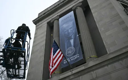 Banner with Trump's image displayed outside Justice Dept. headquarters
