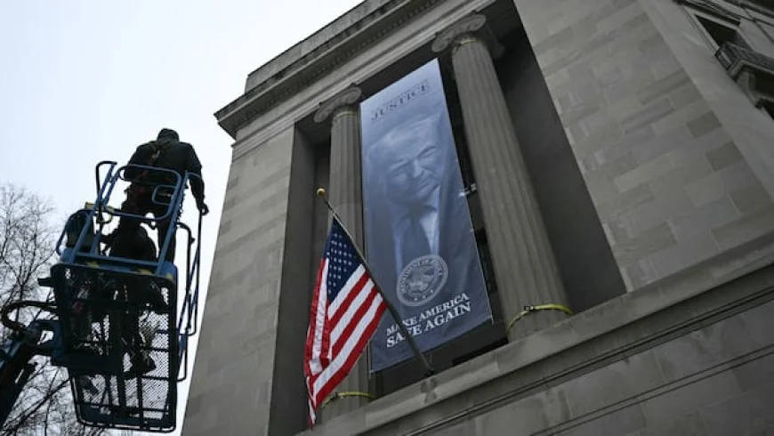 Banner with Trump's image displayed outside Justice Dept. headquarters