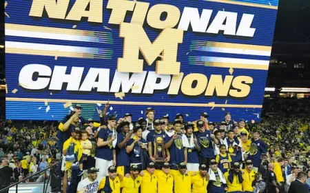 Michigan muscles its way to program's 2nd national title, beating stubborn UConn 69-63