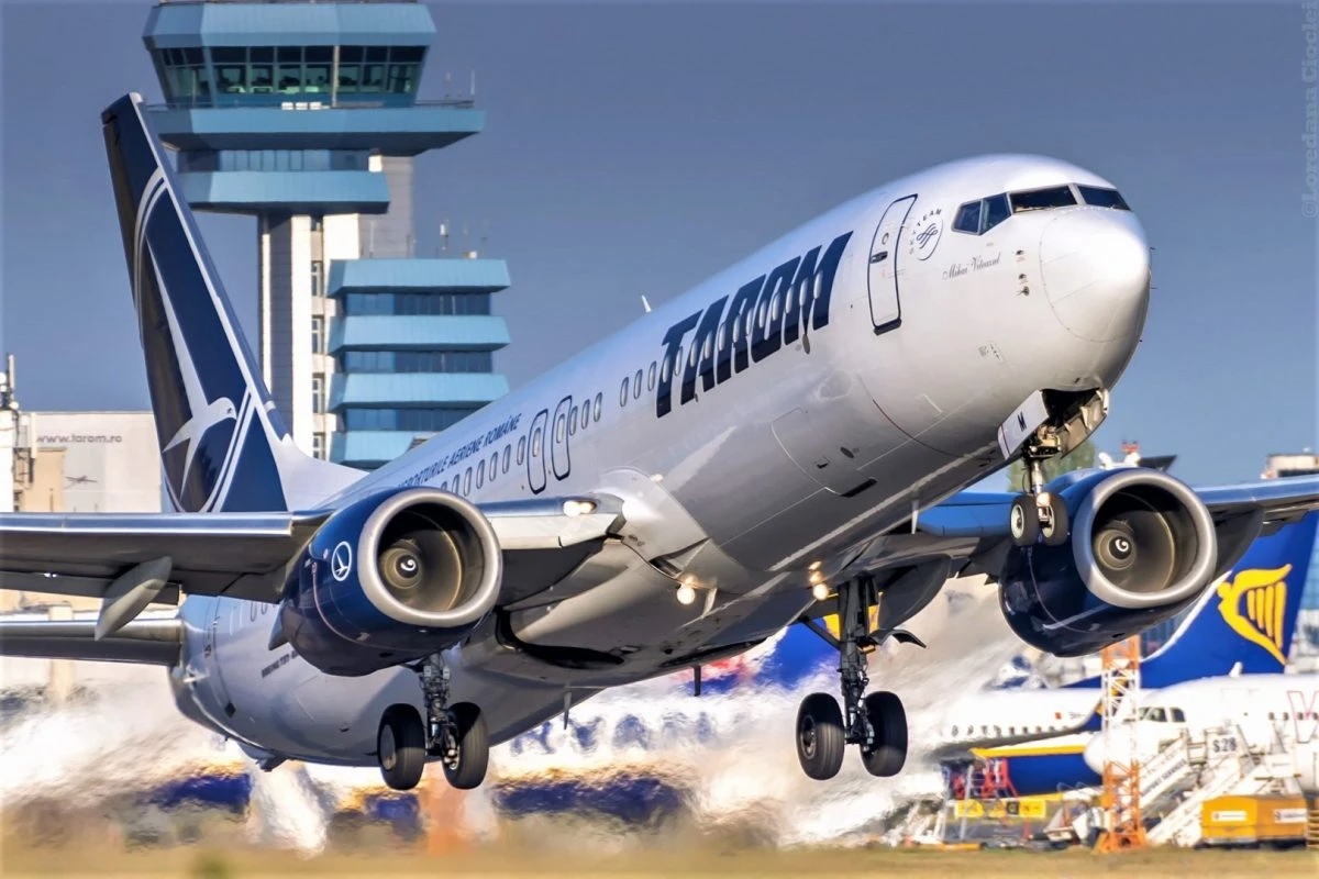 Guvernul Mureșan vrea privatizarea competitivă a TAROM, o gaură neagră cu pierderi pe linie, şi listarea la bursă a unor pachete din Aeroportul Otopeni şi Portul Constanţa